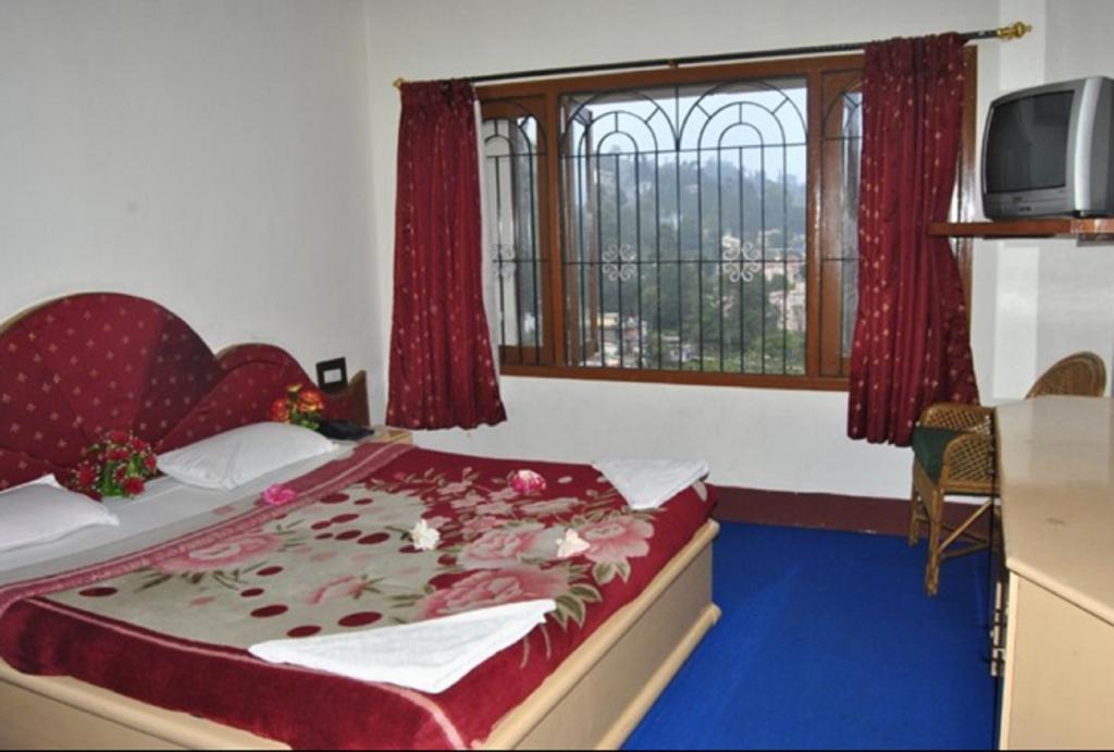 Hotel Ruby International Kodaikanal Pokoj fotografie